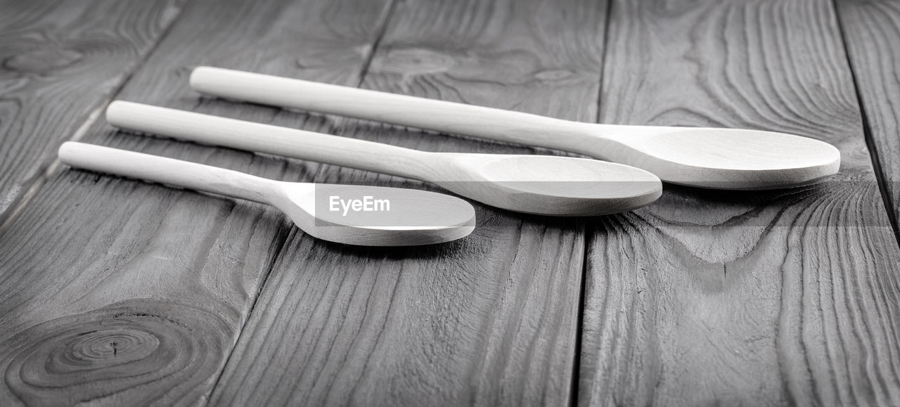 white, wood, spoon, black and white, tableware, indoors, kitchen utensil, monochrome photography, monochrome, no people, table, silverware, still life, still life photography, high angle view, close-up, eating utensil, household equipment, black