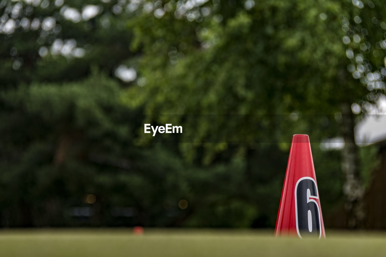 Red cone on golf course