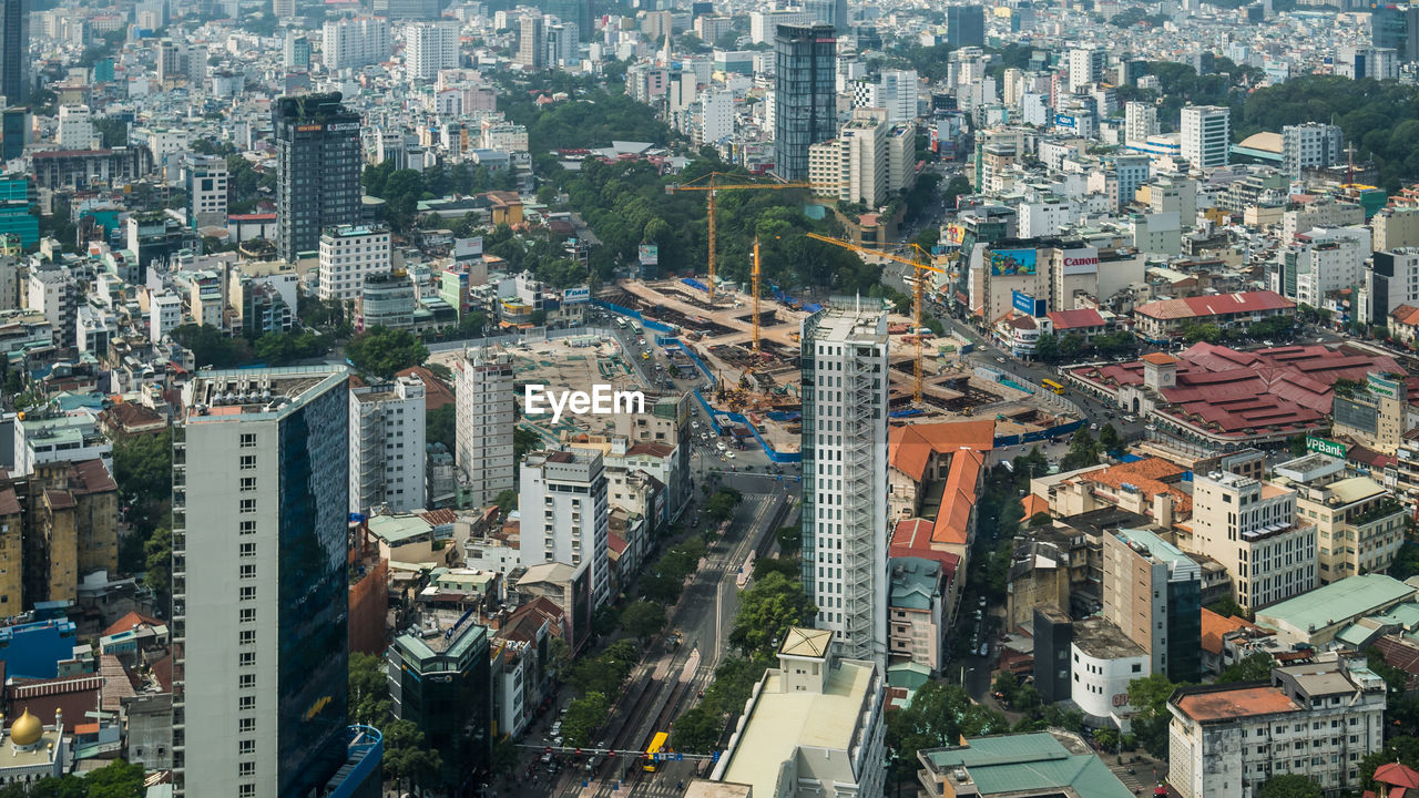 HIGH ANGLE VIEW OF STREET AND BUILDINGS IN CITY