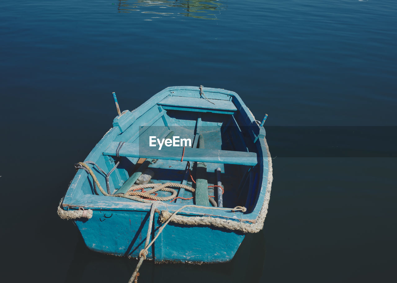 water, nautical vessel, transportation, vehicle, mode of transportation, boat, high angle view, nature, no people, day, sea, moored, reflection, blue, outdoors, watercraft, ship