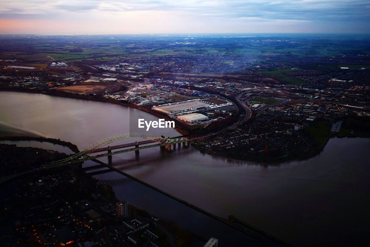 HIGH ANGLE VIEW OF CITY AT RIVERBANK