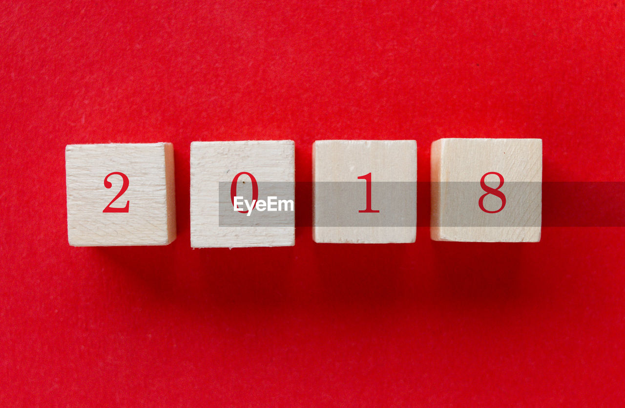 Close-up of number 2018 over red background