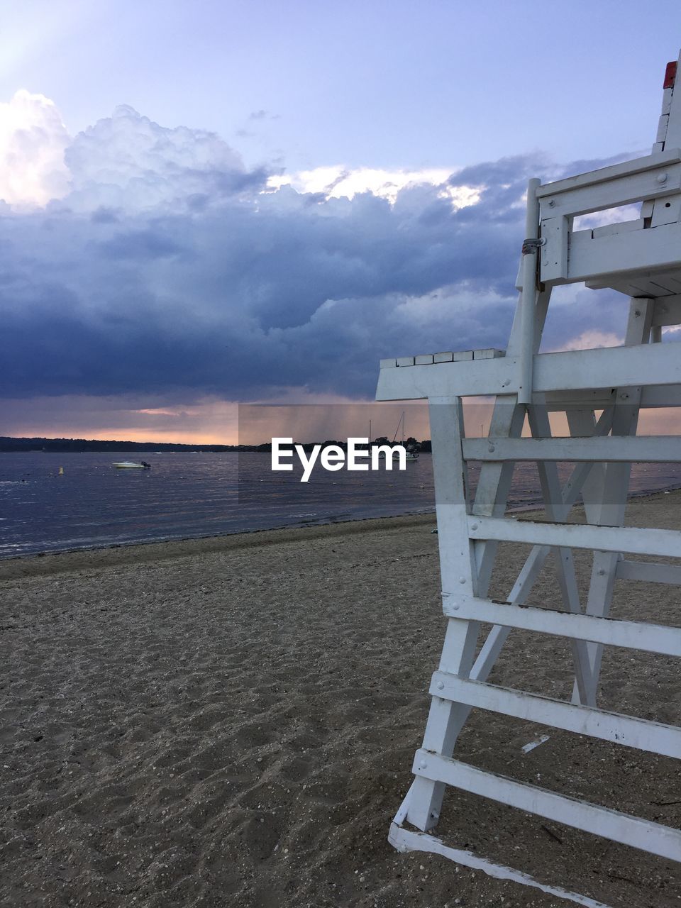 View of calm sea against cloudy sky