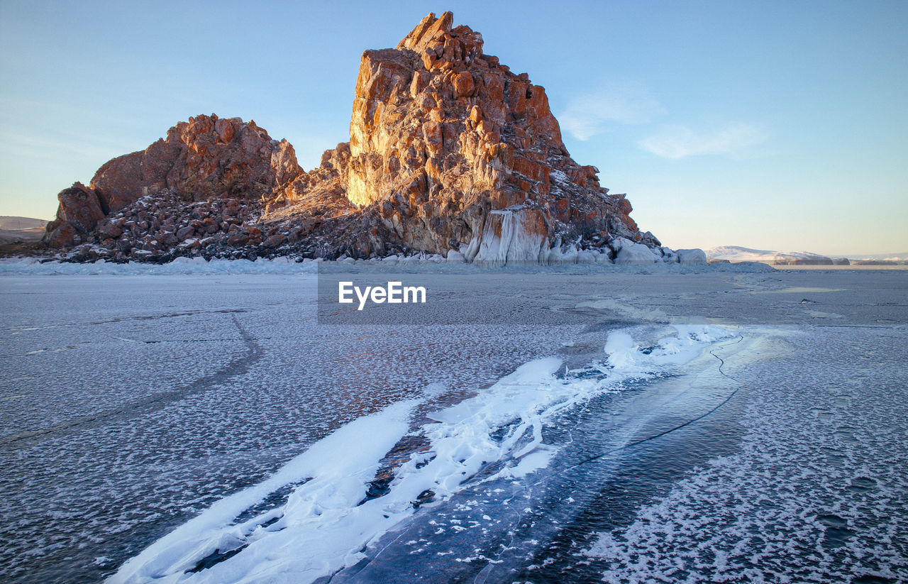 Scenic view of snow covered mountain against sky