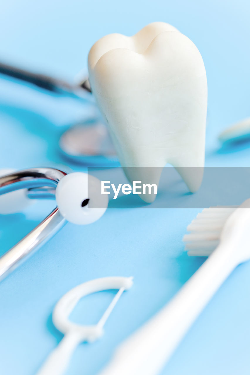 Close-up of dental equipment on blue table