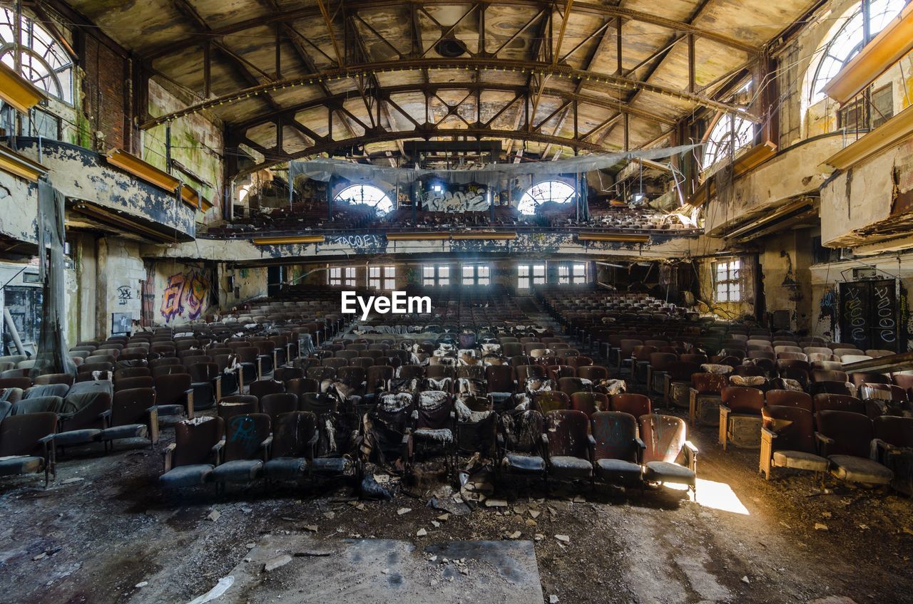 Abandoned chairs in old stage theater