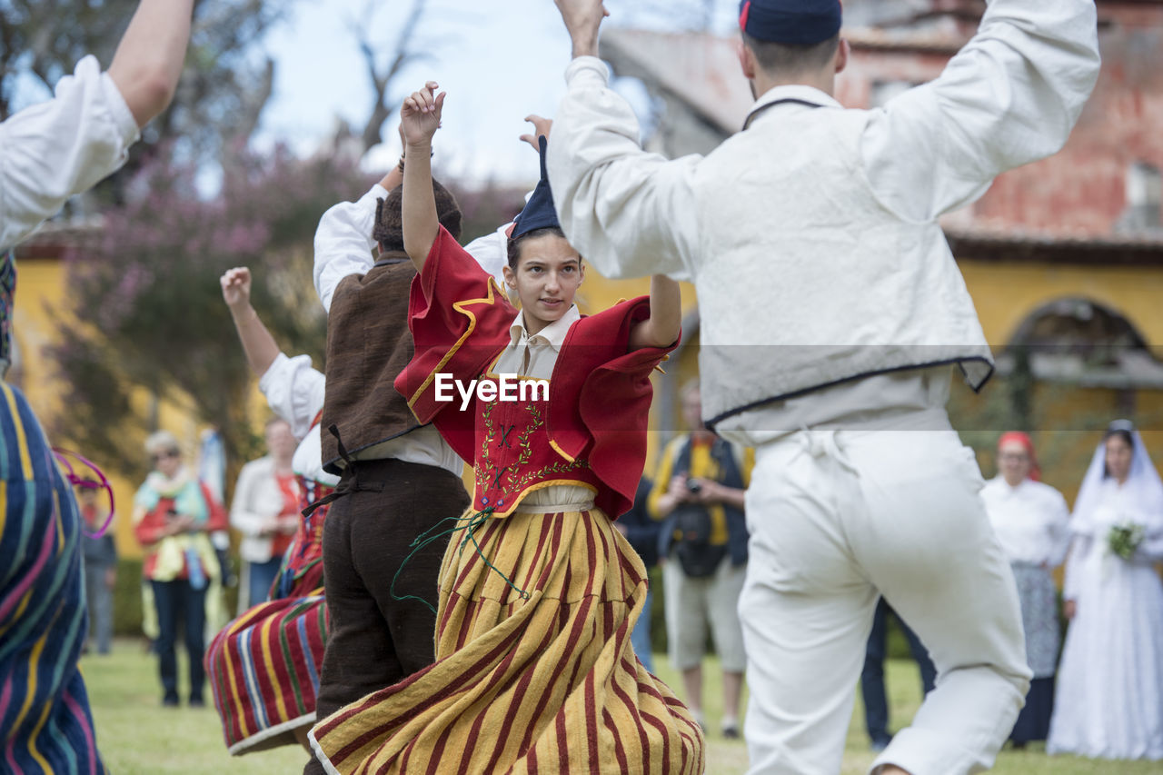 GROUP OF PEOPLE IN MARKET