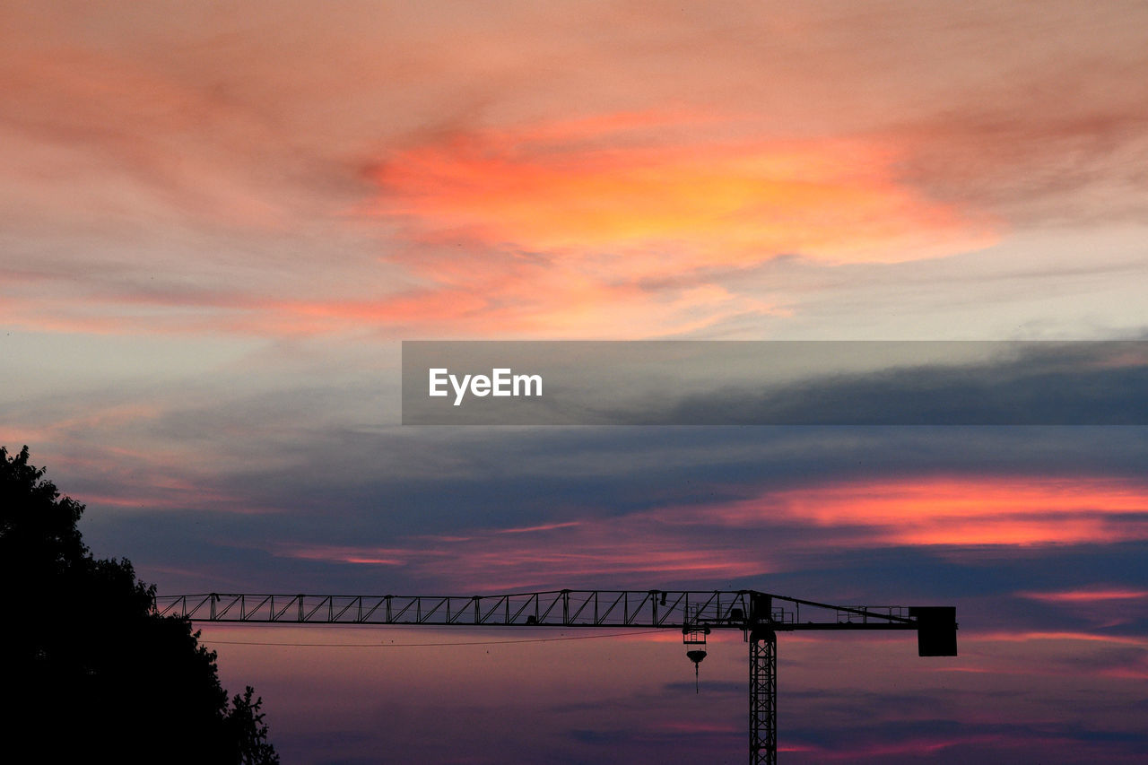 SILHOUETTE BRIDGE AGAINST DRAMATIC SKY