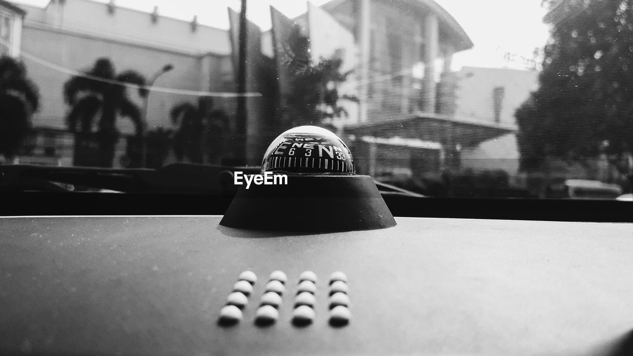 Close-up of ball on table in city