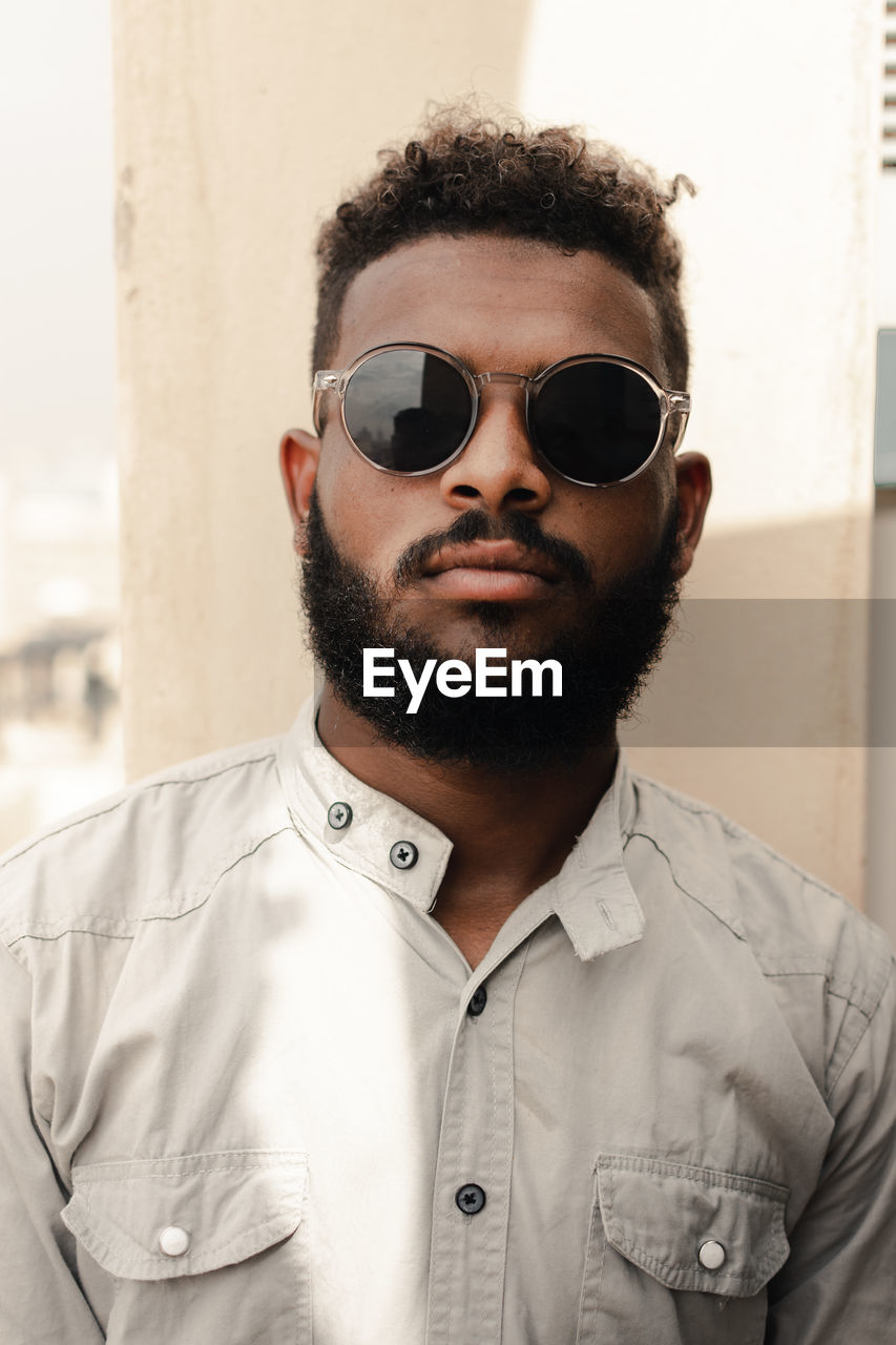 Portrait of young man wearing sunglasses