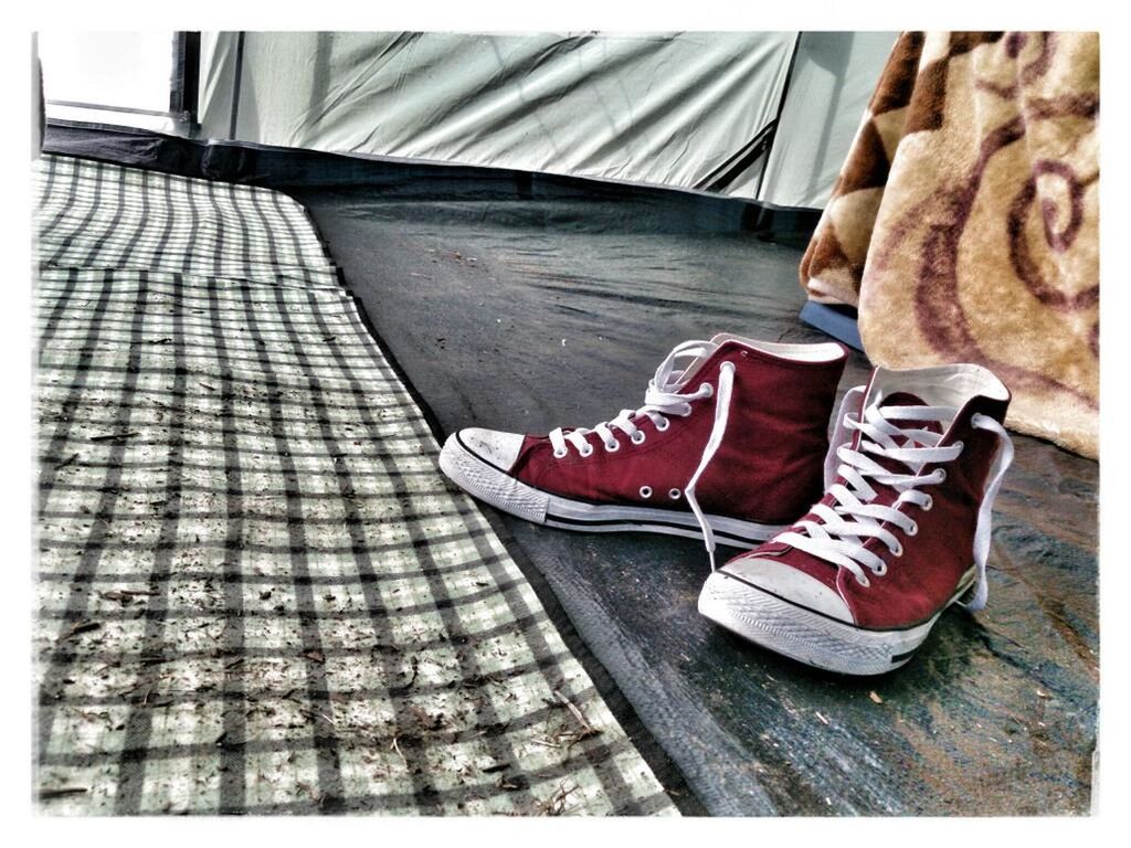 Red canvas shoes on floor at home