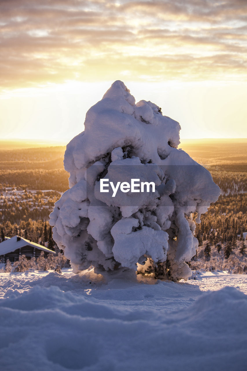 SNOW COVERED LANDSCAPE AGAINST SKY DURING SUNSET