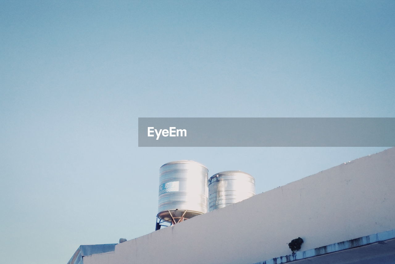 LOW ANGLE VIEW OF FACTORY AGAINST SKY