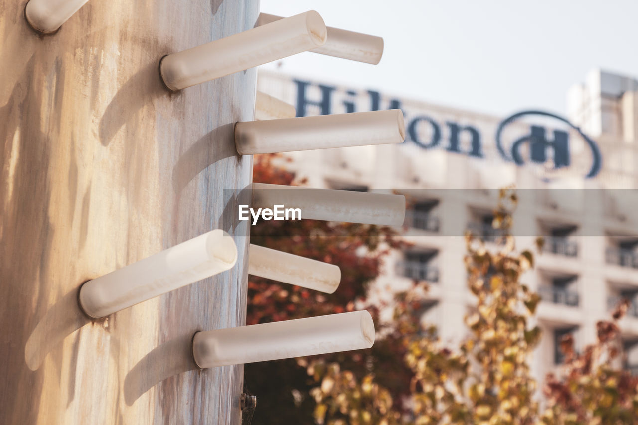 CLOSE-UP OF TEXT ON WOODEN WALL