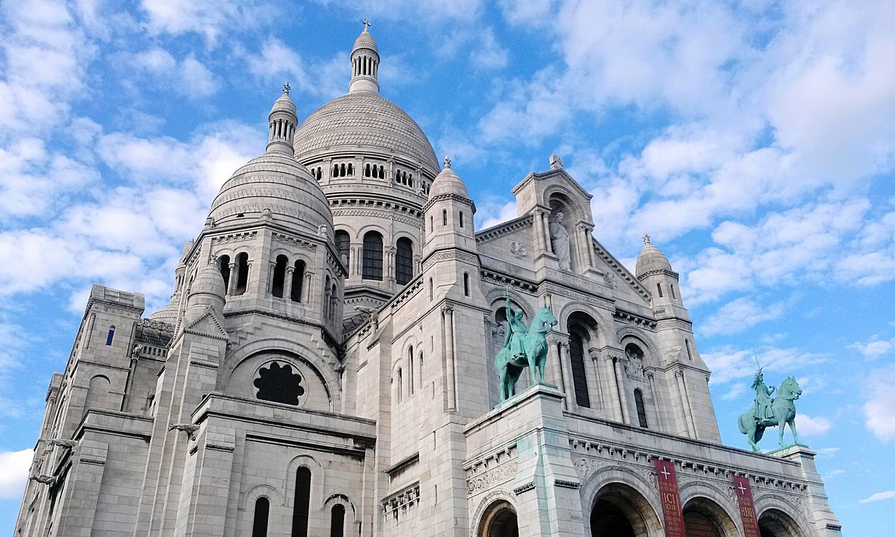 Low angle view of basilique du sacre coeur at montmartre against sky