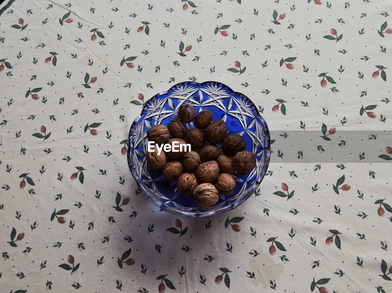 High angle view of walnuts in bowl on table
