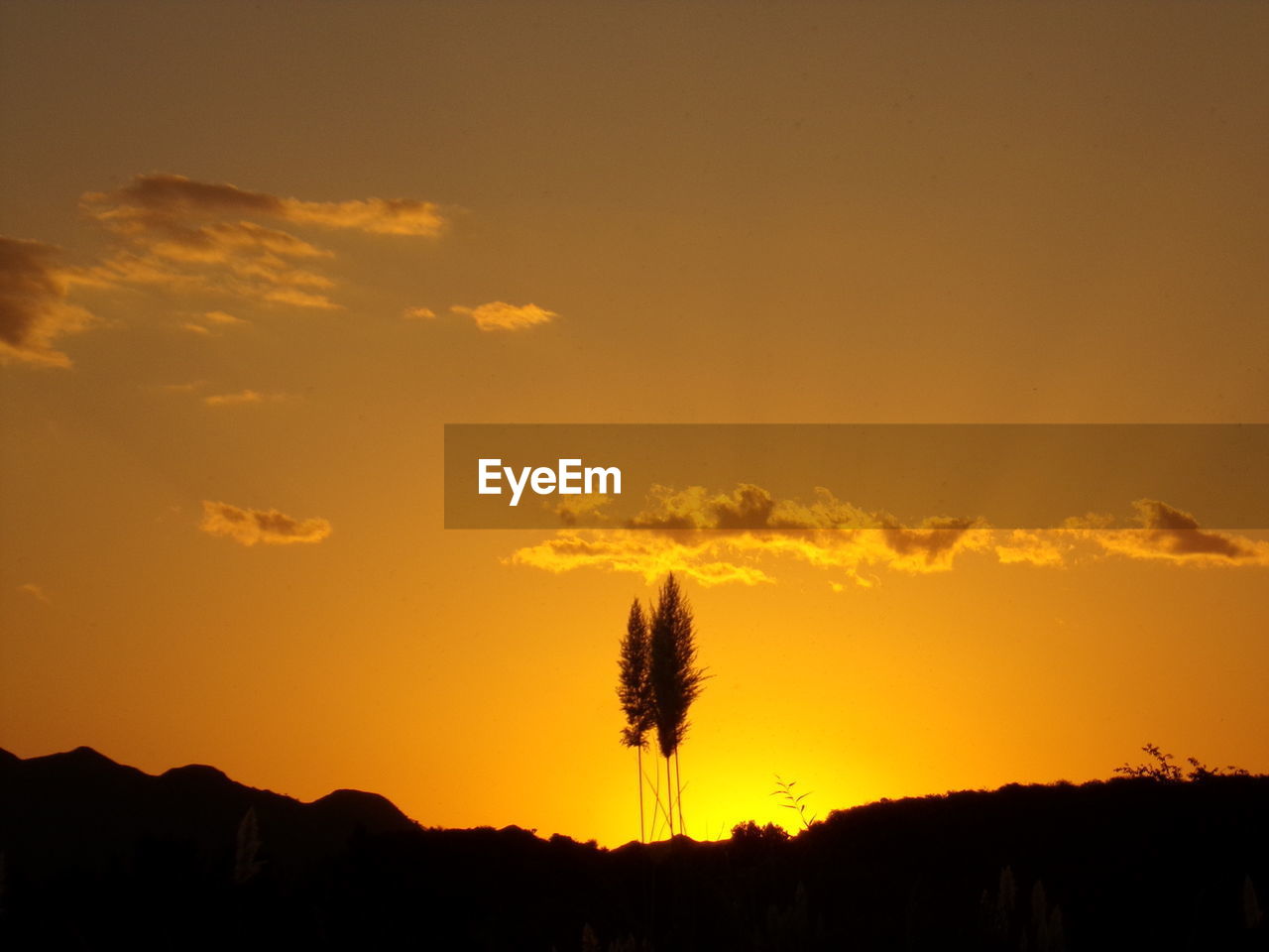 SILHOUETTE LANDSCAPE AGAINST SKY DURING SUNSET