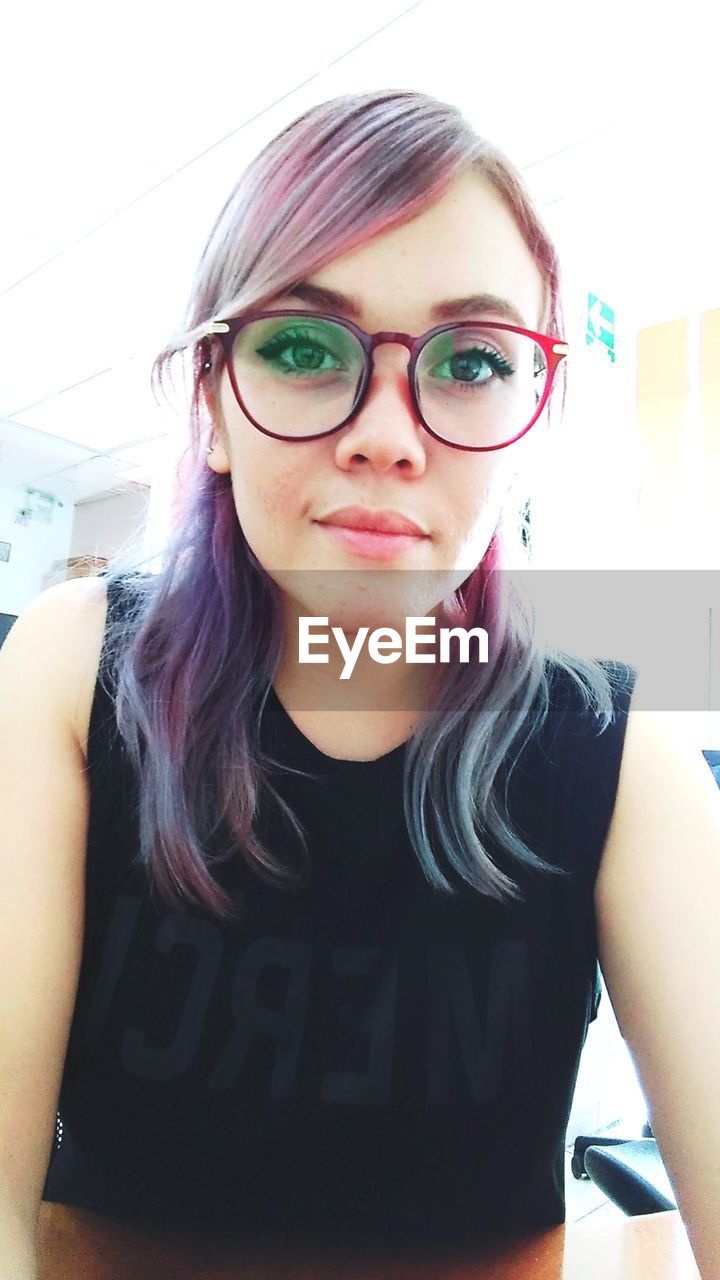 Portrait of young woman with dyed hair 