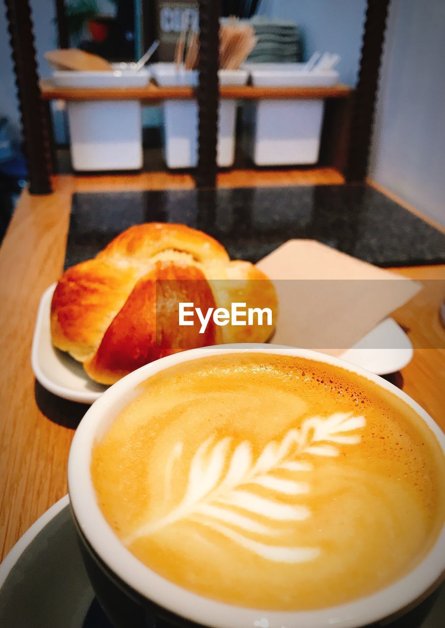 CLOSE-UP OF COFFEE ON TABLE