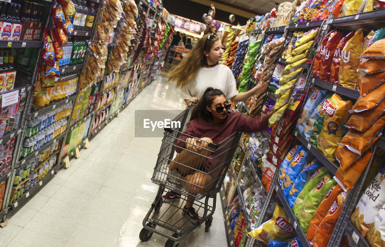 HIGH ANGLE VIEW OF WOMAN IN STORE