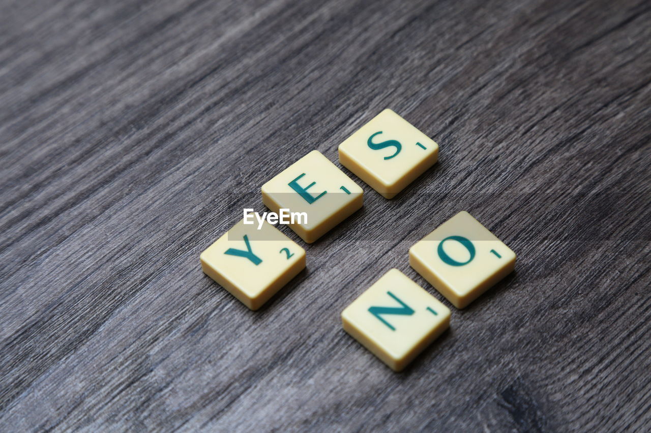 Close-up of text on wooden table