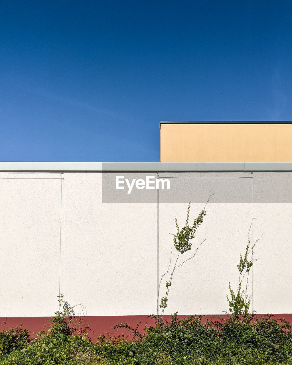 Low angle view of building against clear blue sky