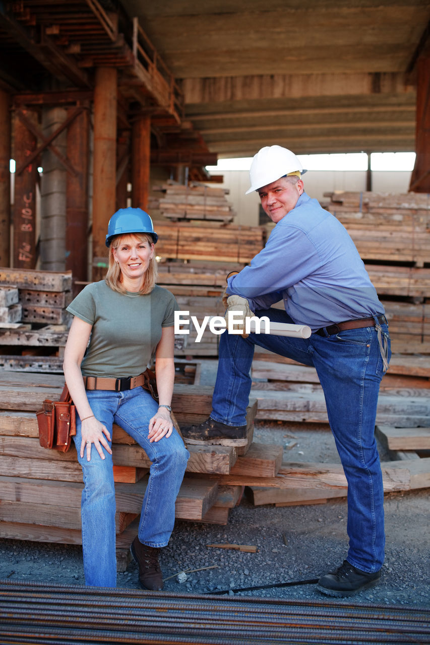 Portrait of male and female construction workers