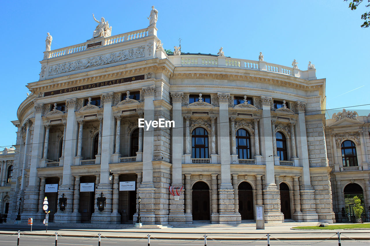 Low angle view of historical theatre building against sky