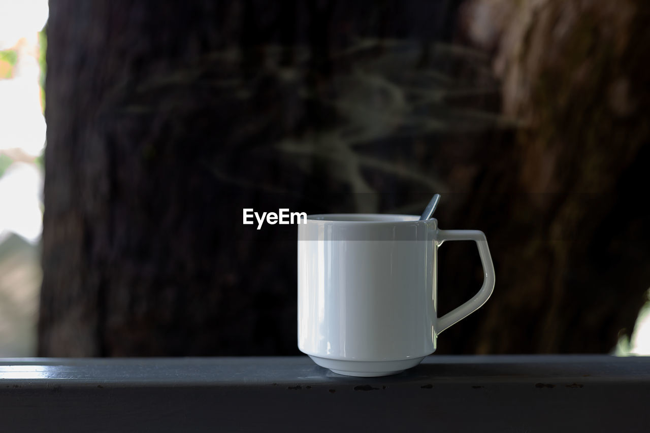 Close-up of coffee cup on table