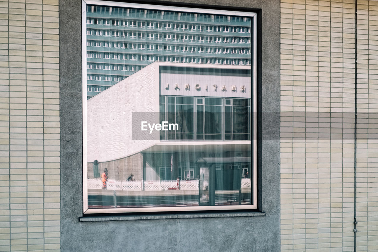 TEXT ON GLASS WINDOW OF BUILDING