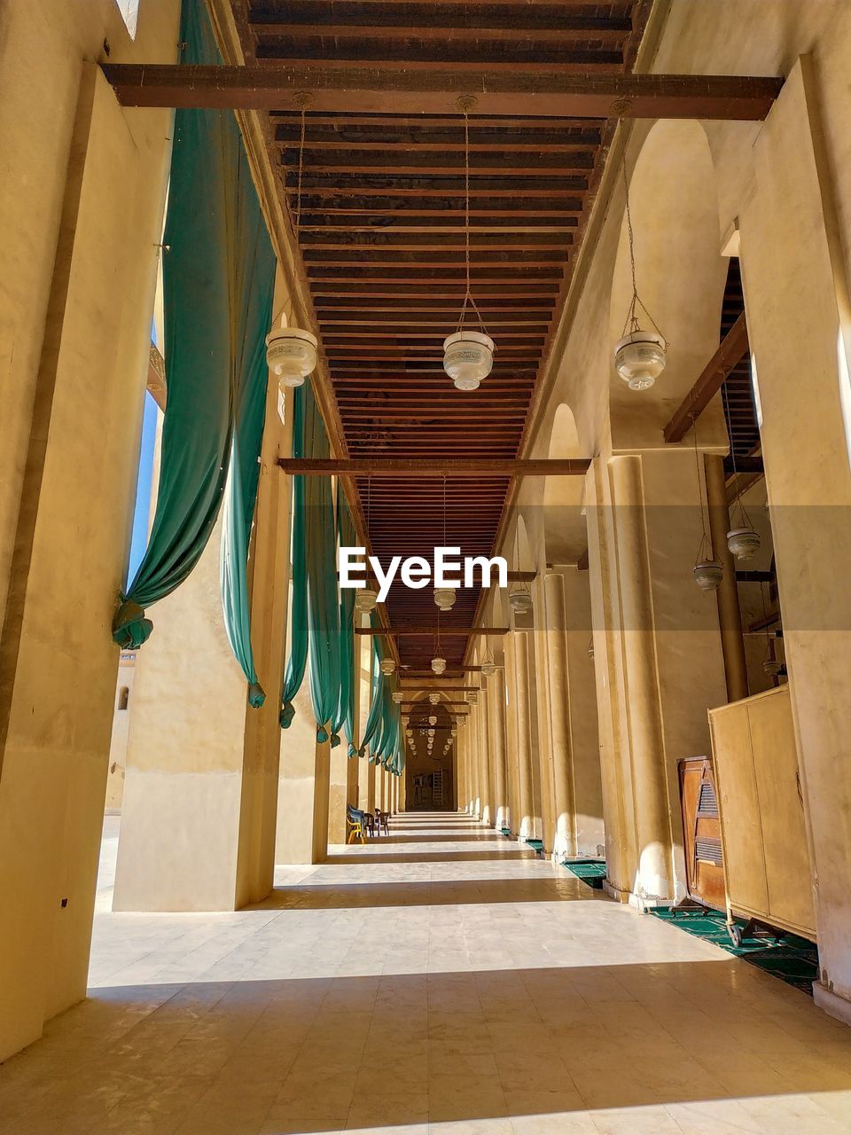 LOW ANGLE VIEW OF CORRIDOR IN BUILDING