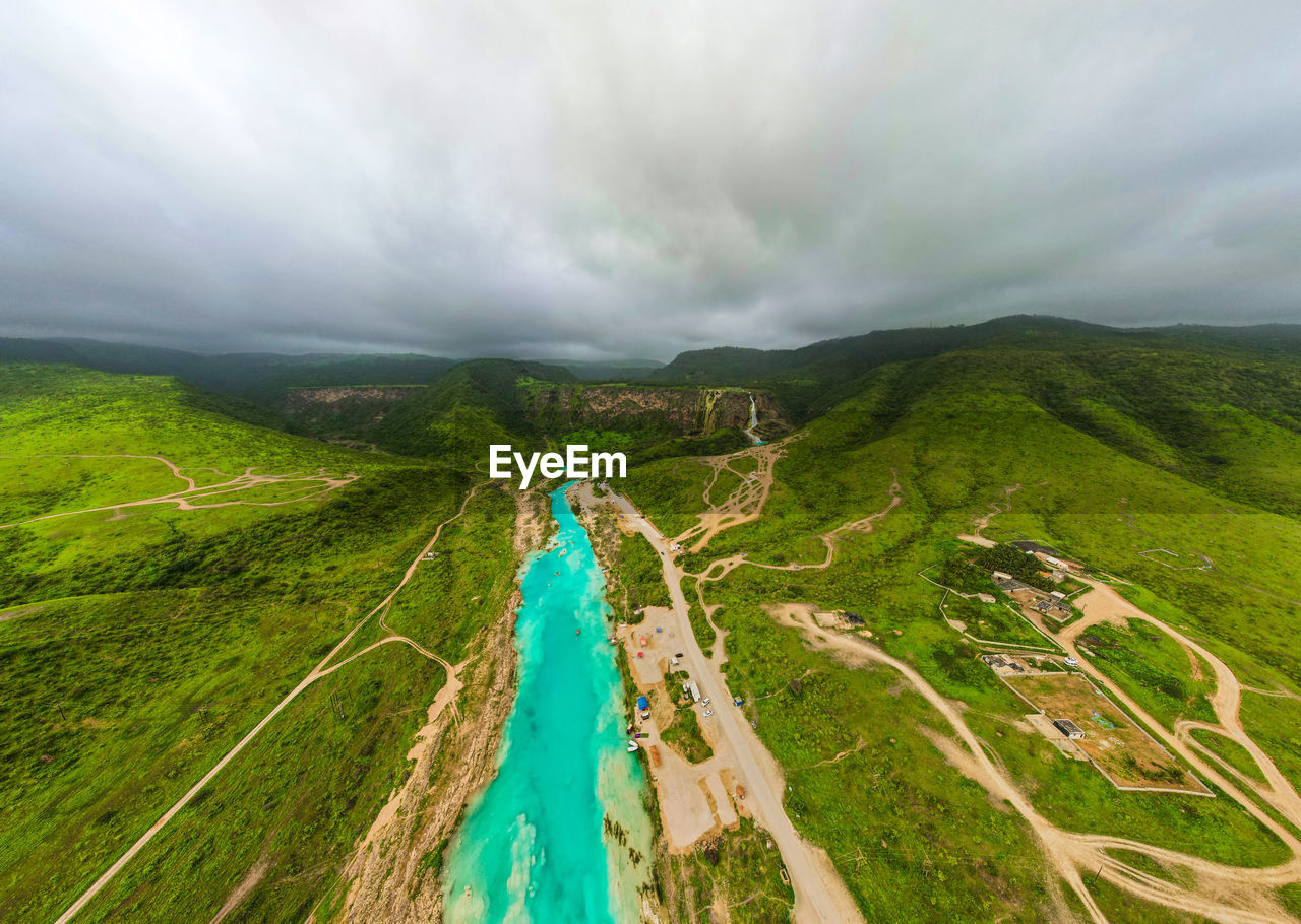 A panoramic picture of the darbat waterfall in the sultanate of oman, the city of salalah