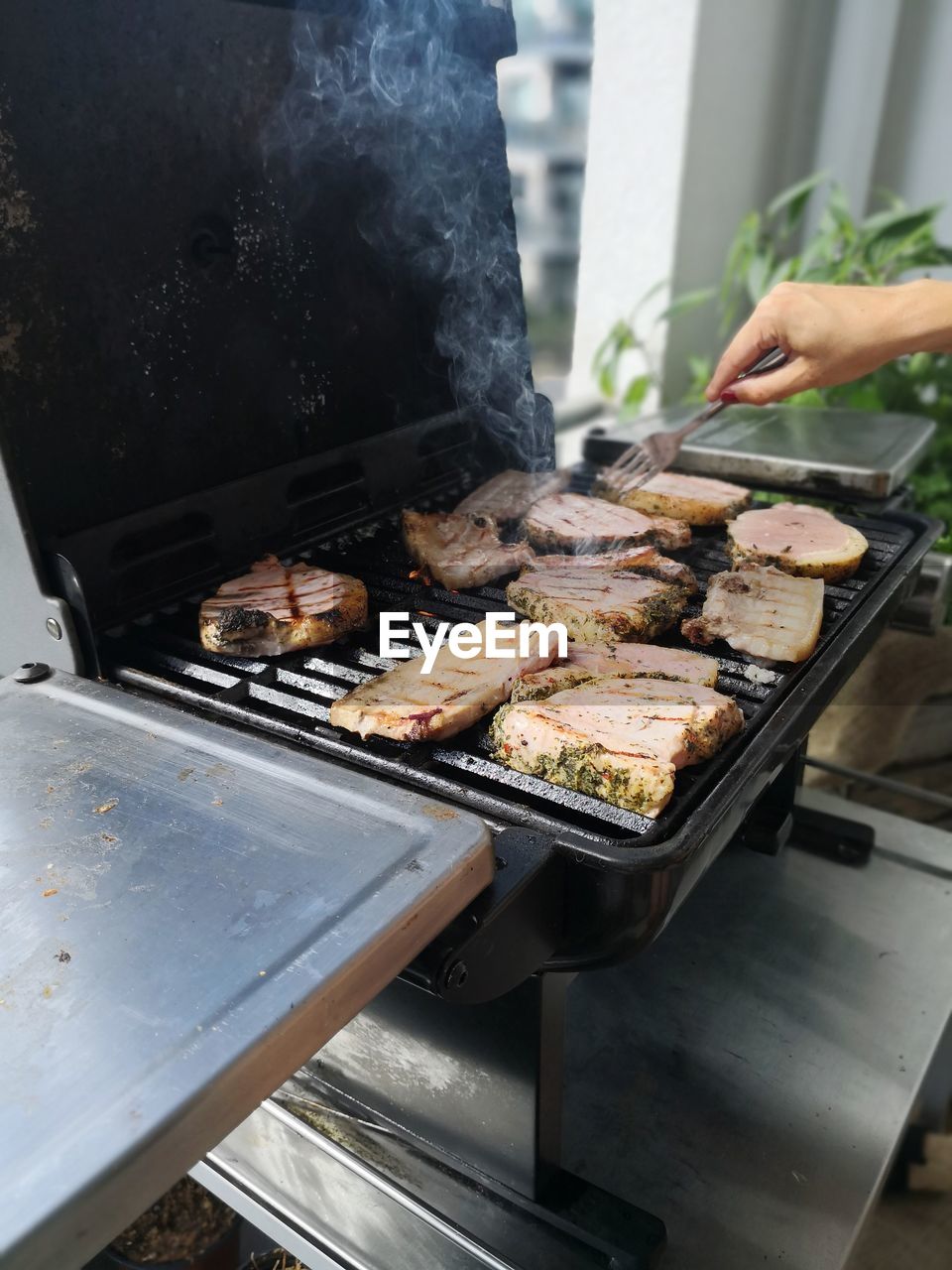 High angle view of meat on barbecue grill