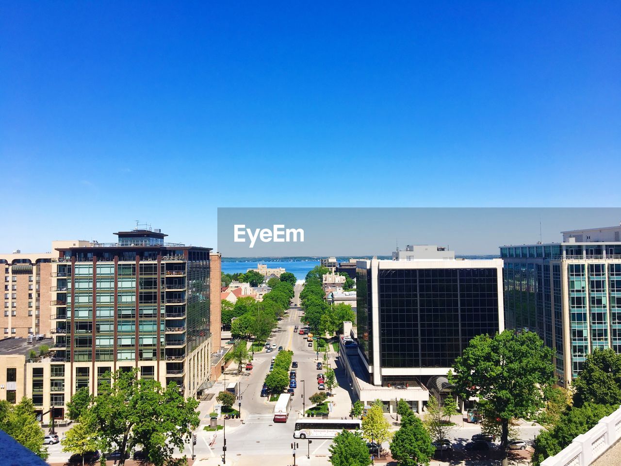 Buildings against clear blue sky