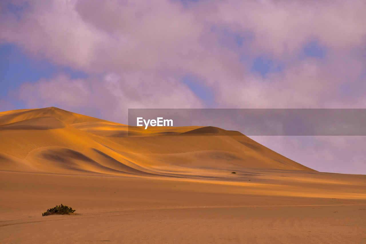 Strokes of deep orange sand, namib desert