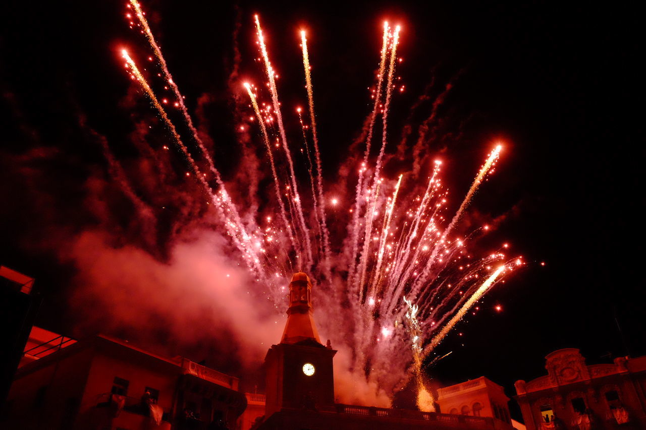 Firework display over city