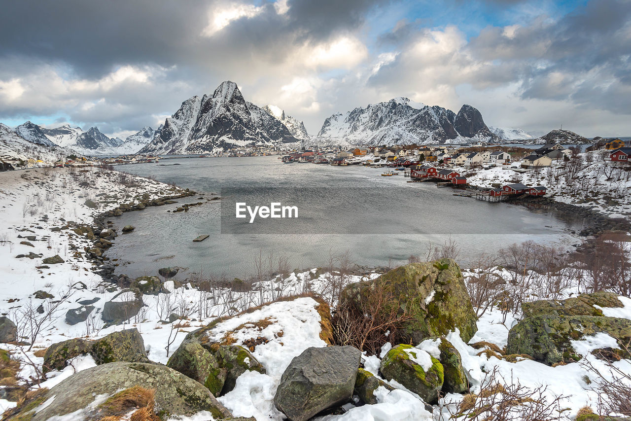 Scenic view of lake against sky during winter