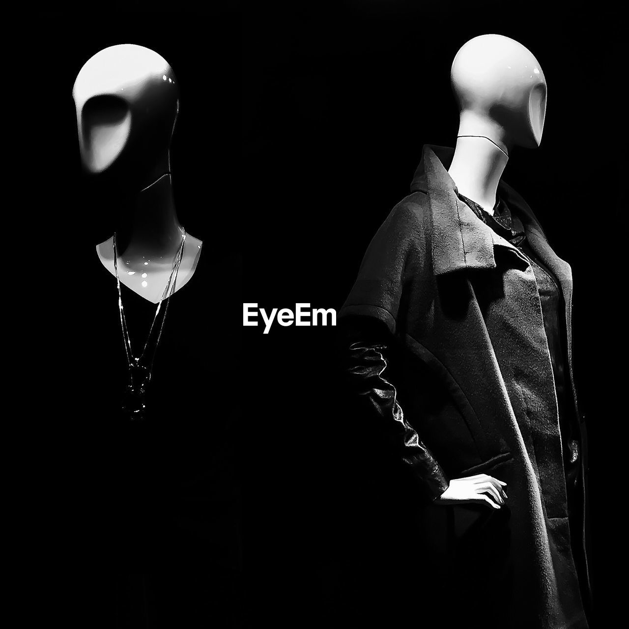 Mannequins against black background