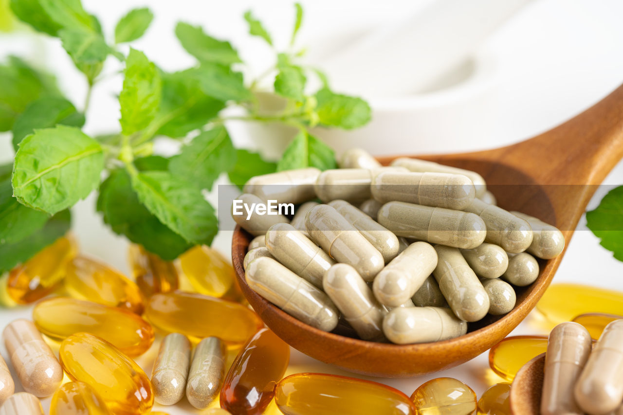 high angle view of pills in bowl on table