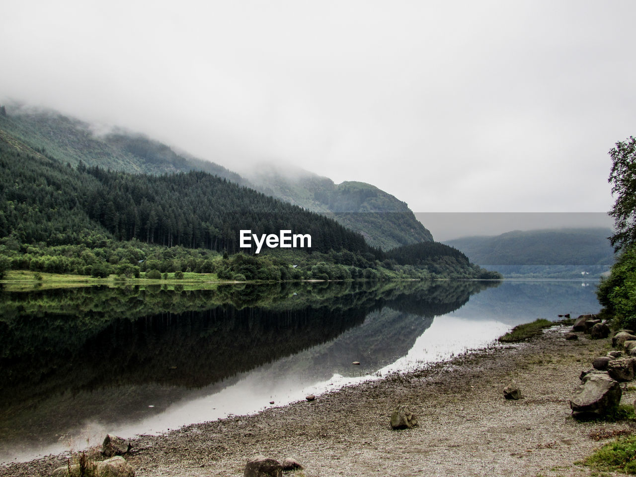 Scenic view of lake with mountains in background