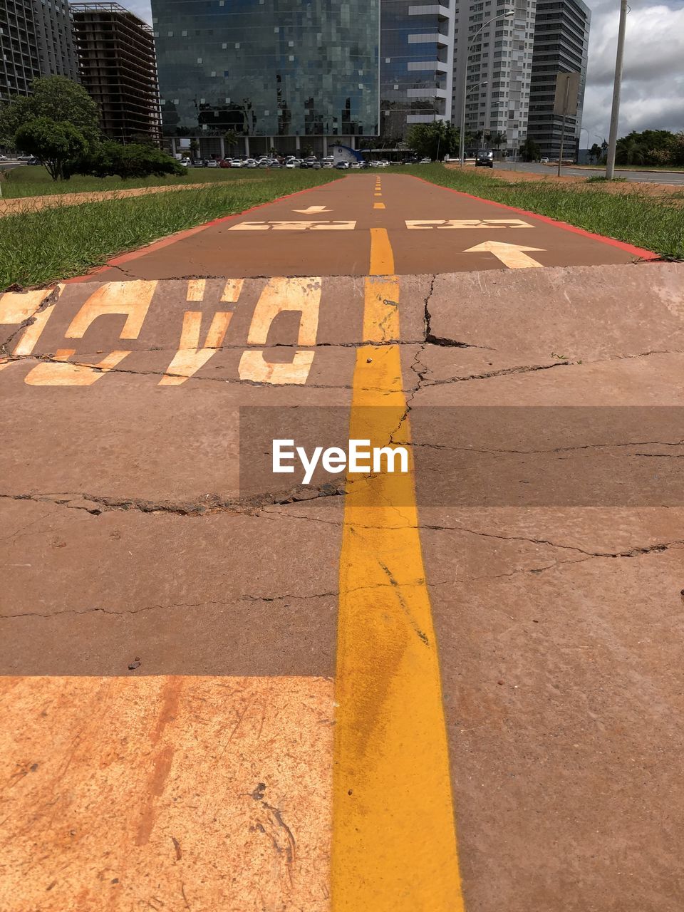 SURFACE LEVEL OF ROAD SIGN AGAINST BUILDINGS