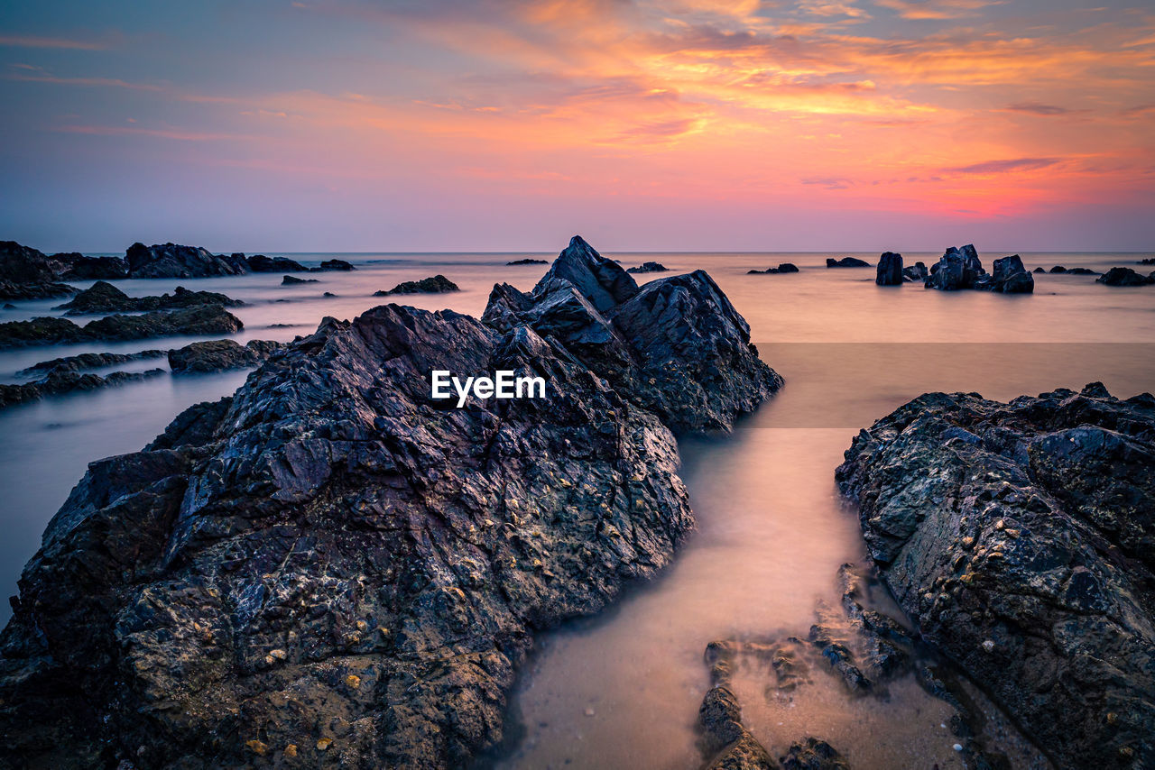 Scenic view of sea against sky during sunset