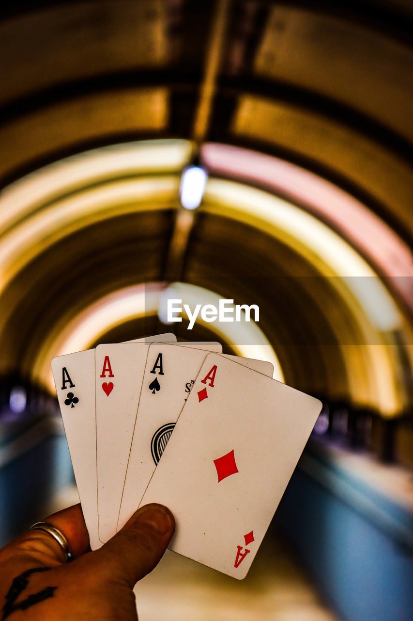 Close-up of hand holding playing cards