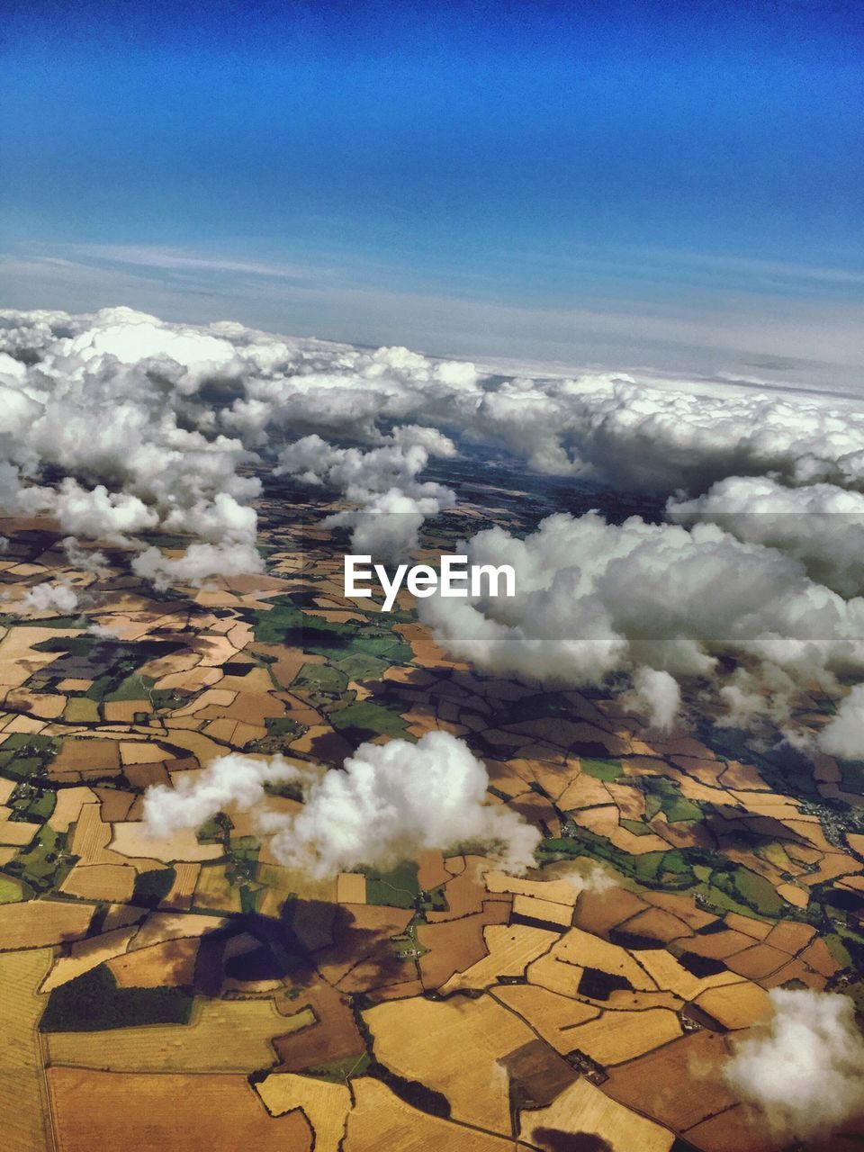 Clouds over countryside landscape