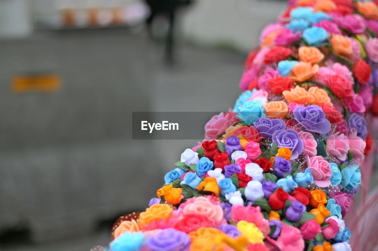 Close-up of multi colored flowers on decoration