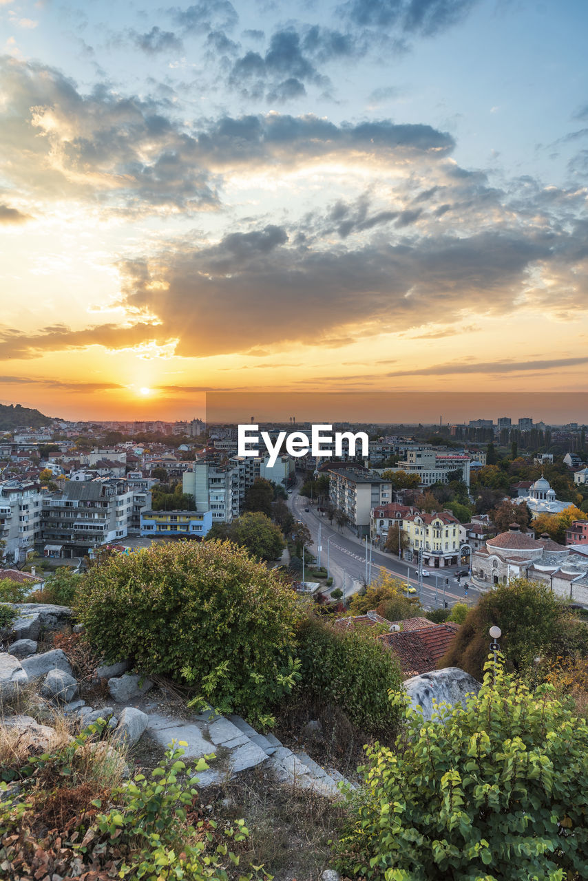 High angle view of buildings against sky during sunset