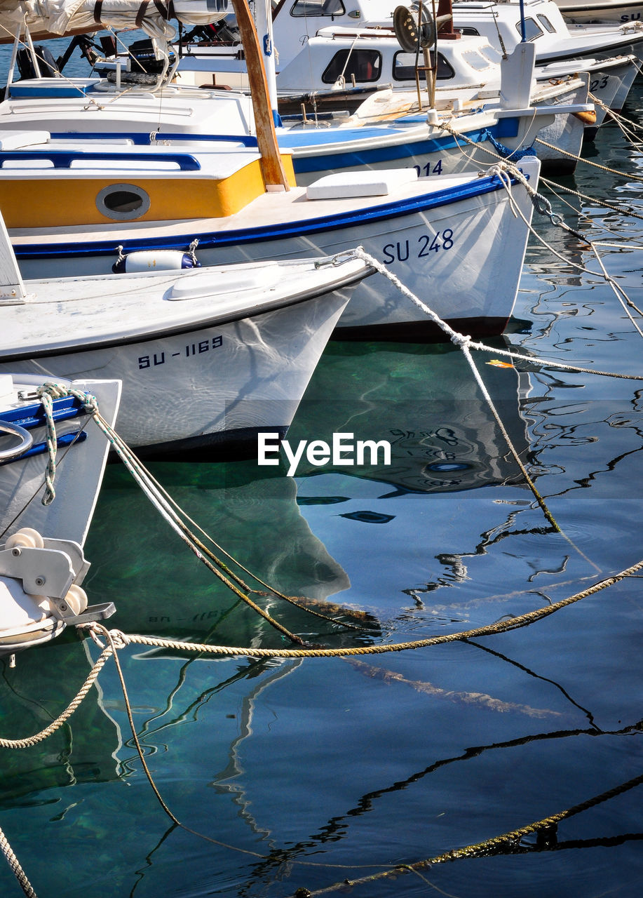 Boats moored at harbor