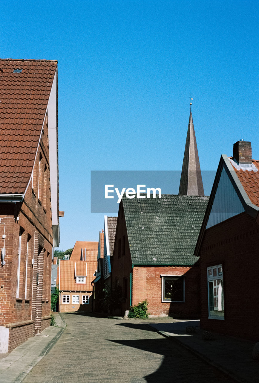 BUILDINGS AGAINST BLUE SKY