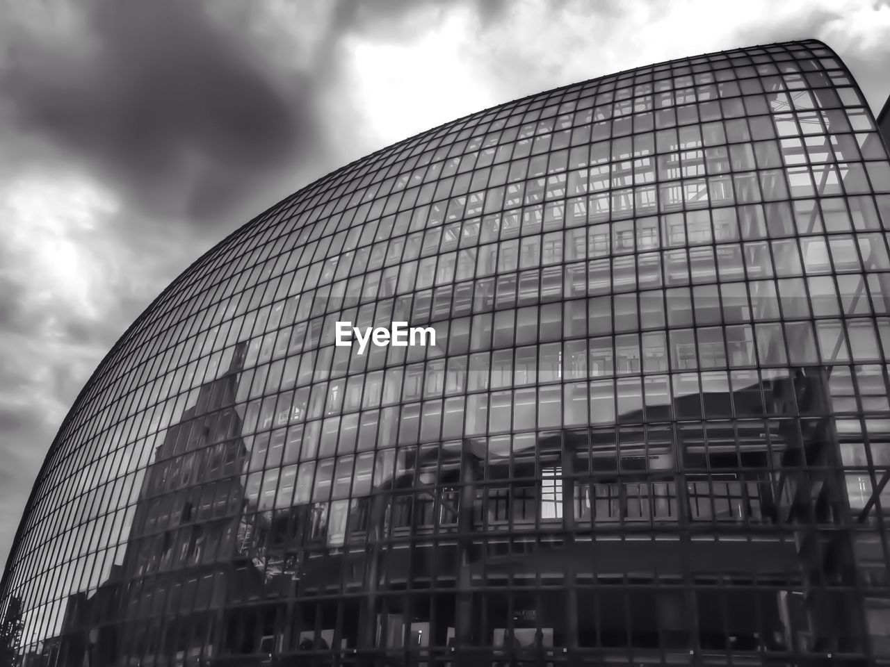 Reflection of buildings on glass structure