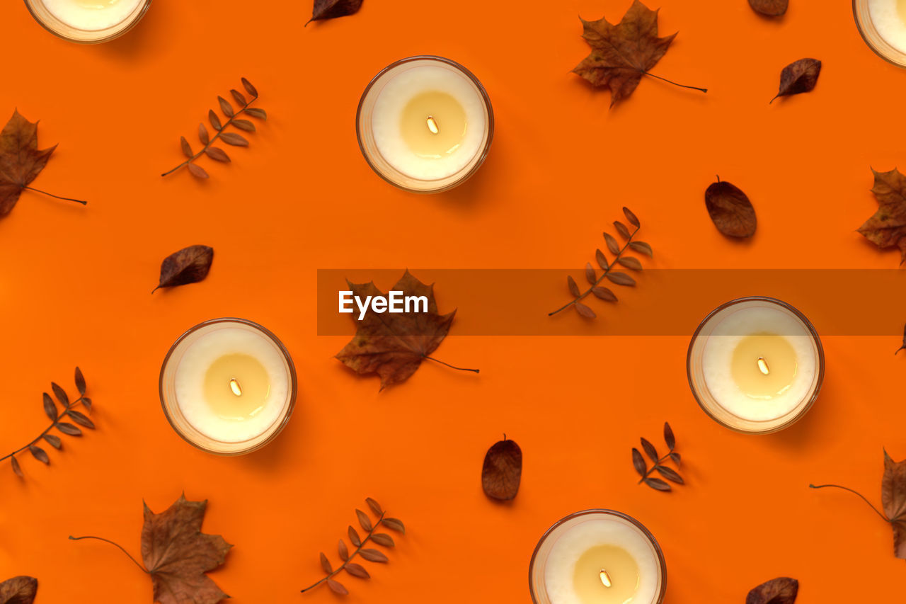 Burning vanilla candle pattern. warm aesthetic halloween autumn, thanksgiving day composition 
